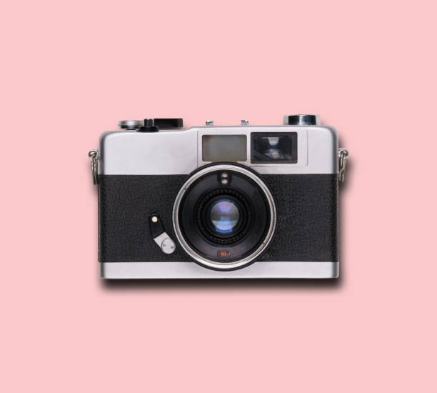 istock vintage old film camera on pink background 1525363607