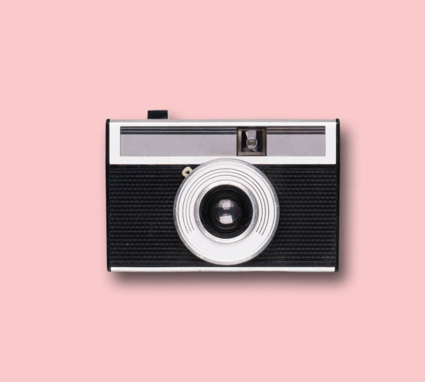 istock vintage old film camera on pink background 1525363608