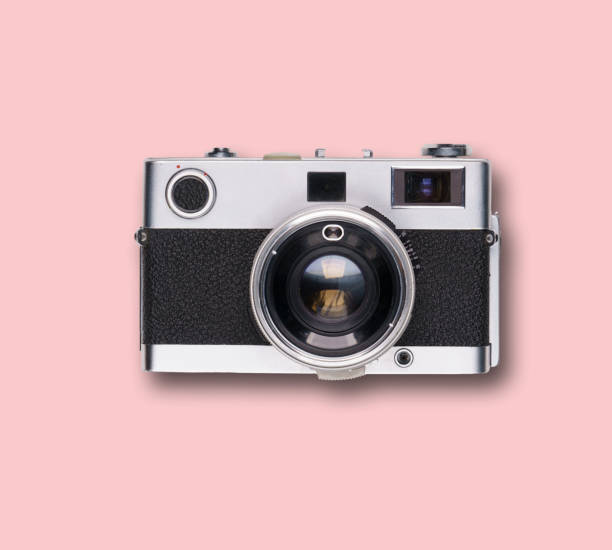 istock vintage old film camera on pink background 1525363617