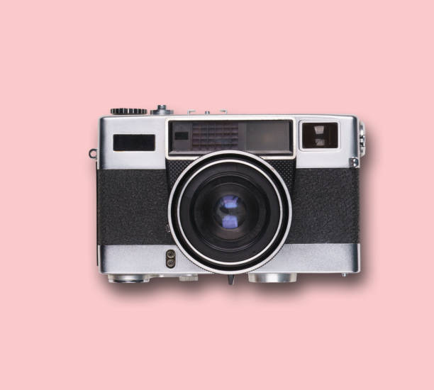istock vintage old film camera on pink background 1525363618