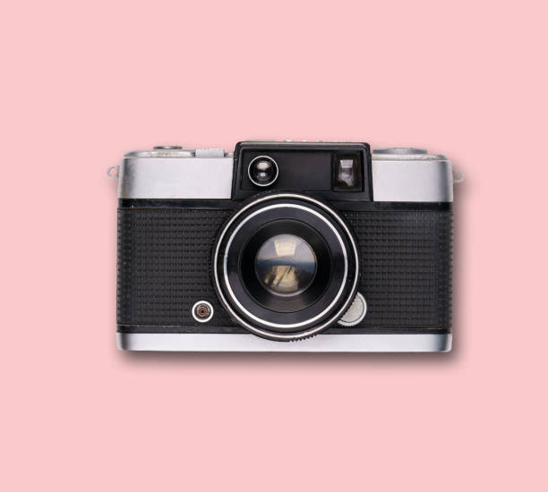 istock vintage old film camera on pink background 1525363622