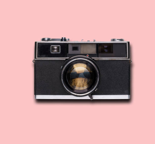 istock vintage old film camera on pink background 1525363650
