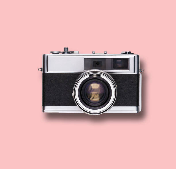 istock vintage old film camera on pink background 1525363651
