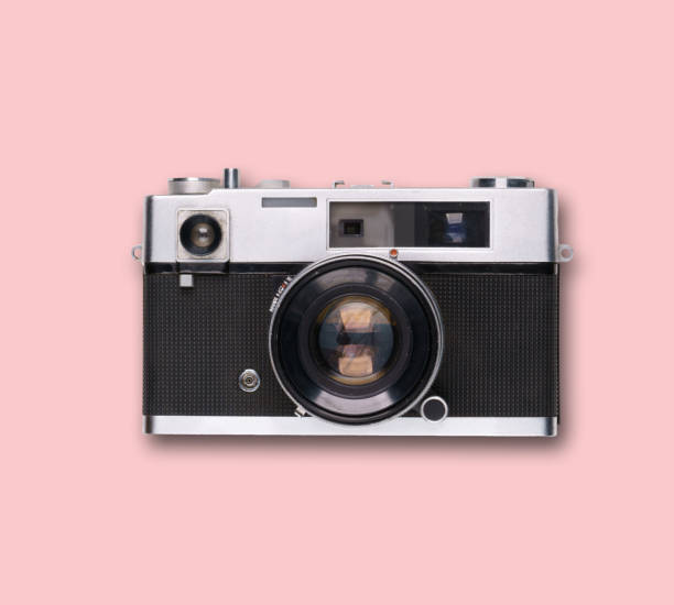 istock vintage old film camera on pink background 1525363653