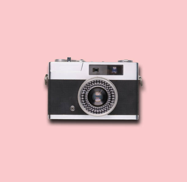 istock vintage old film camera on pink background 1525363678