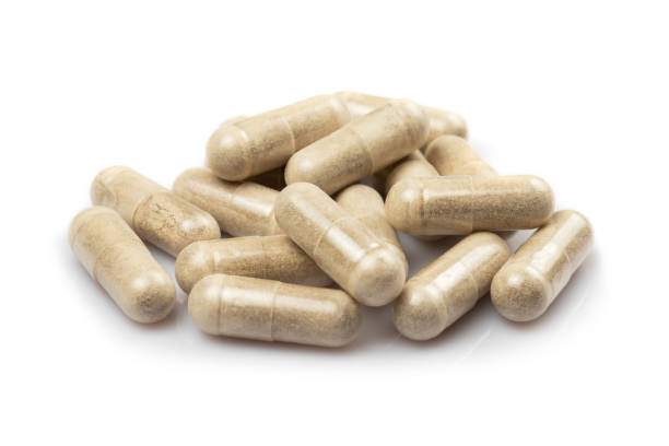 istock Vitamin C capsules on a white background. macro photography. 1525365273