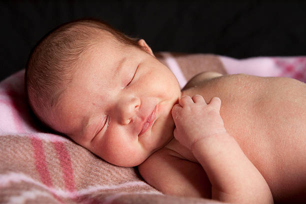 sleeping newborn stock photo