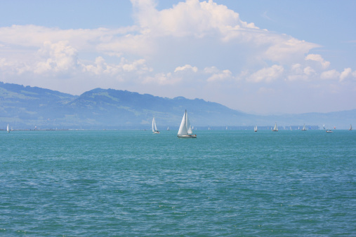 The Lake Bodensee in Germany on  summer day. The focus is on the boat in the middle of the picture