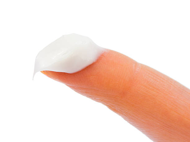 istock Woman finger and cream 152537478