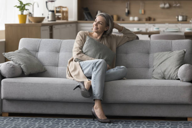 istock Cheerful dreamy grey haired woman enjoying weekend, leisure 1525380415
