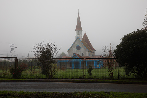 Foggy landscape church in south Chile\nValdivia province