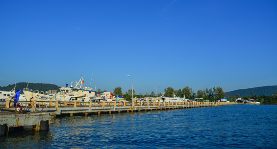 Phu Quoc, Vietnam - Dec 16, 2017. Ferries docking at pier in Phu Quoc Island, Vietnam. Phu Quoc is a Vietnamese island off the coast of Cambodia in the Gulf of Thailand.