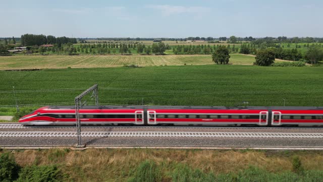 Europe, Italy , Milan - Frecciarossa Hight speed 300km h train raylway from Milano  to Rome view from the drone - the faster way to travel in Italy for tourist and passengers - tourist destination