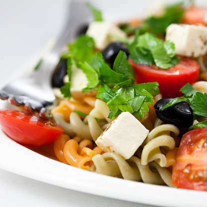 salad with pasta,vegetables and feta cheese