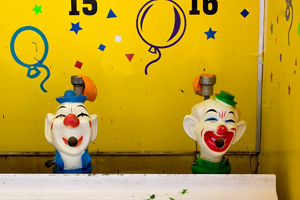 istock Clown faces on fairground stall 152538725
