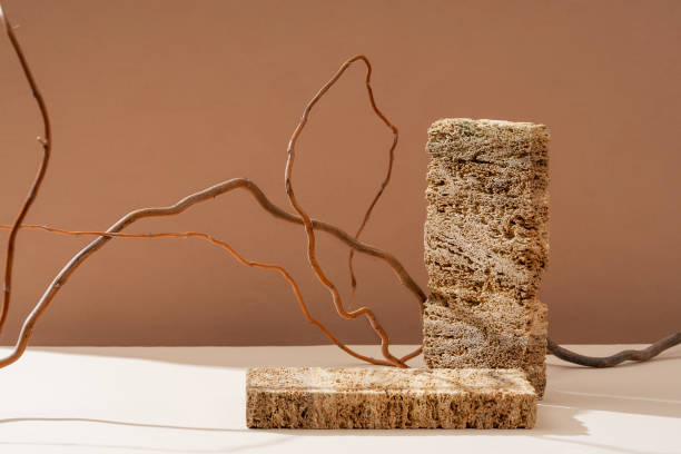 istock Podium for exhibitions and product presentations material stone, eucalyptus branch. Beautiful beige background made of natural materials. Abstract nature scene with composition. 1525390256