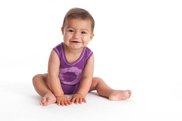 happy baby girl sitting on the floor - 嬰兒 圖片 個照片及圖片檔