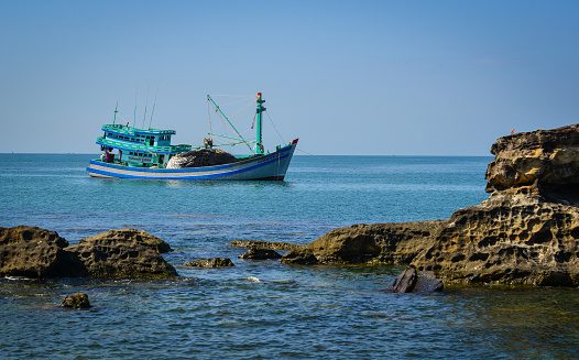 Phu Quoc, Vietnam - Dec 7, 2017. A fishing boat on the sea in Phu Quoc, Vietnam. Phu Quoc is an island off the coast of Cambodia in the Gulf of Thailand.