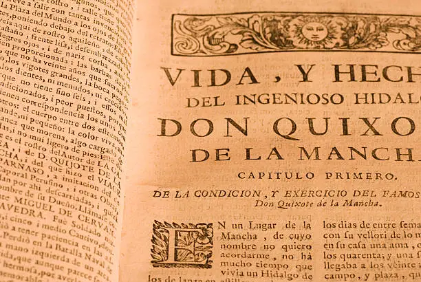 "The first page of the book Don Quijote of the Mancha, masterpiece of the Spanish literature. In the photography the title of the work is reflected, the title of the first chapter and part of the text that begins with the famous expression "" in a place of the Mancha of whose name I do not want to remember... ""    "