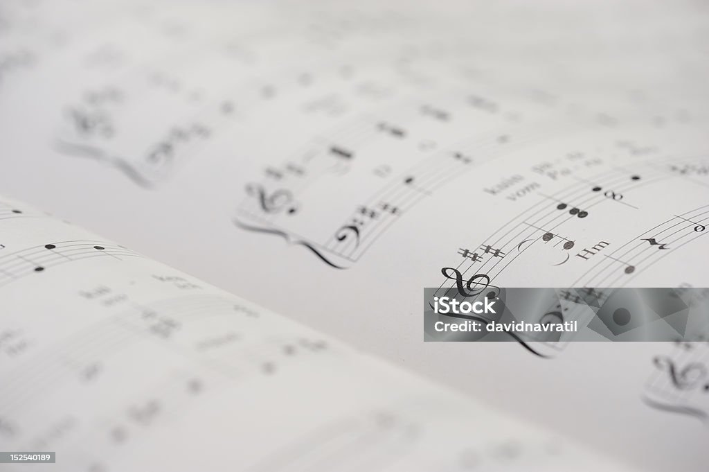 Pianoforte nota libro - Foto stock royalty-free di Bianco