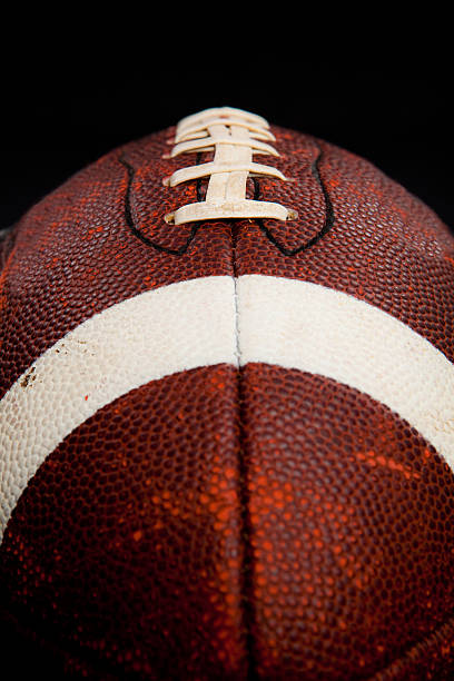 istock Football against black 152540501
