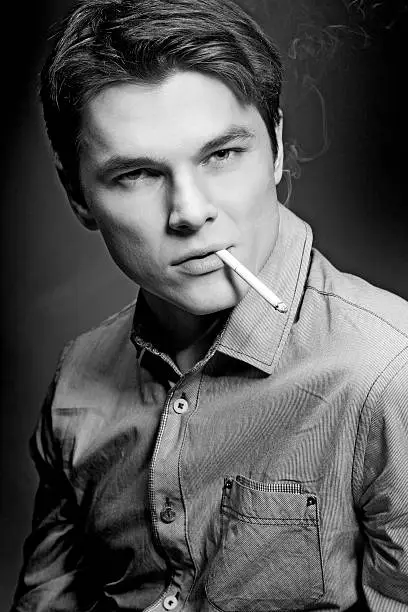 Photo of Man smoking cigarette