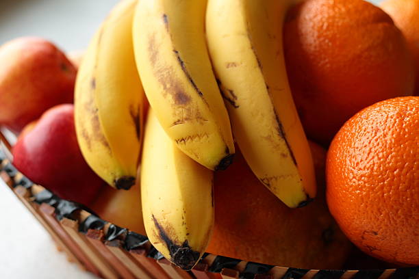 Basket Of Fruit Apples Oranges And Bananas Stock Photo - Download