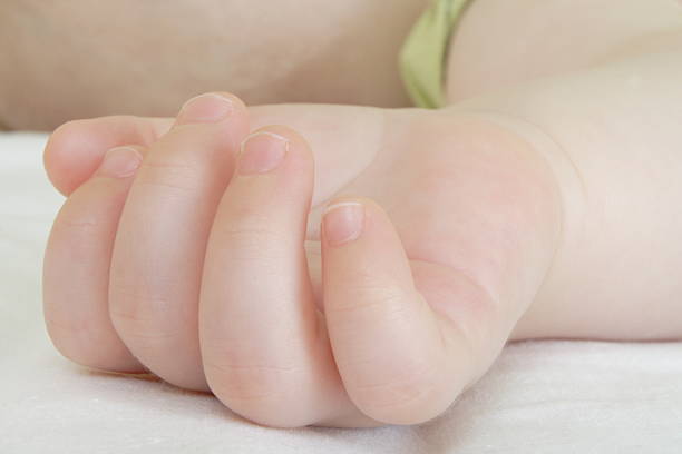 istock hand of a sleeping baby 152542265