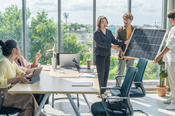 Business meeting presentation for solar energy in office stock photo