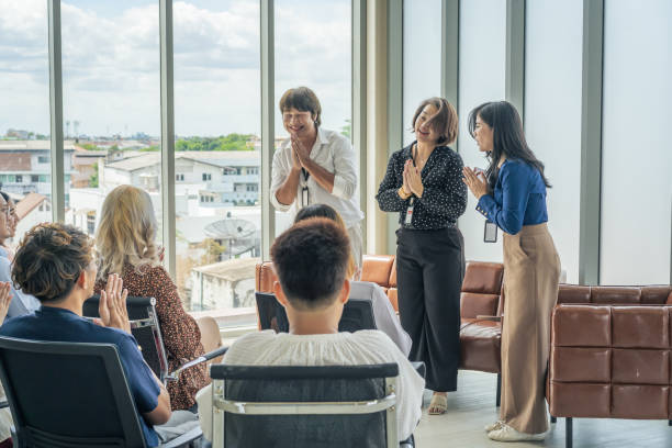 Business people meeting attending a seminar in board room stock photo