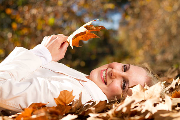 istock woman in autumn forest 152543767