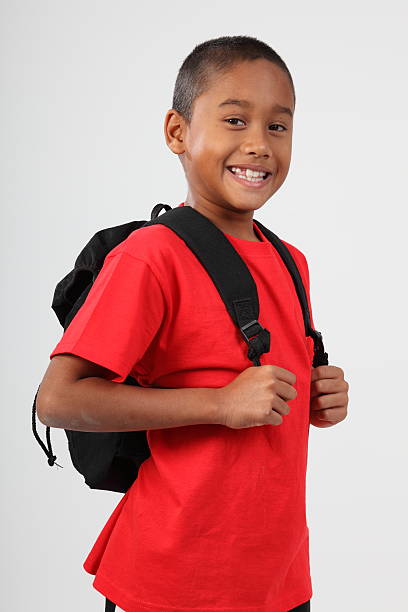 istock School boy 9 wearing red and happy smile in studio 152544157