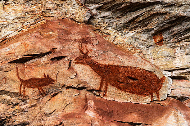 Cave Painting Rock Painting on a Cave at the archaeological site of Pedra Pintada in Barao de Cocais - Brazil cave painting photos stock pictures, royalty-free photos & images