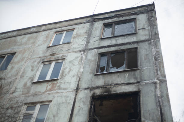istock Burnt house. Apartment burned down in multi-storey building. Fire in apartment. Broken window. Abandoned building. 1525442220