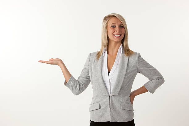 istock Smiling women holding palm up. 152546099