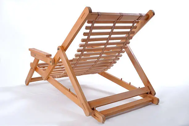 A wooden sun chair, on a white background, back-view.