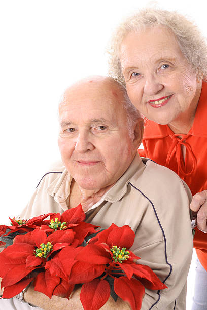 istock eldery couple with flowers vertical 152547208
