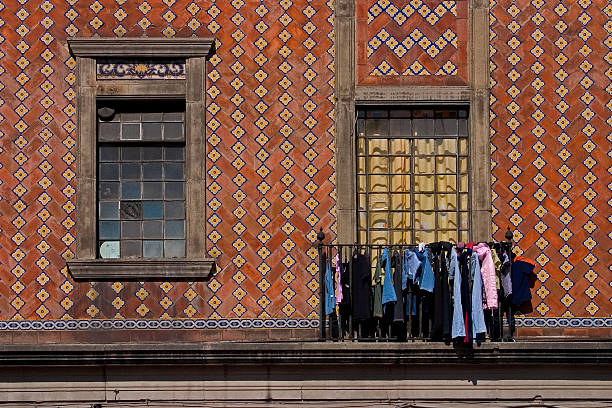 Clothes hanging outside a window to dry. stock photo