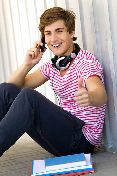 istock Male student with thumbs up 152547604