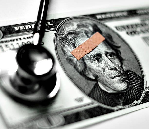 interferire con denaro - currency stethoscope medicare usa foto e immagini stock