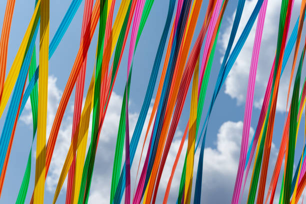 Multicolored ribbons in the wind against sky, Berlin Tiergarten