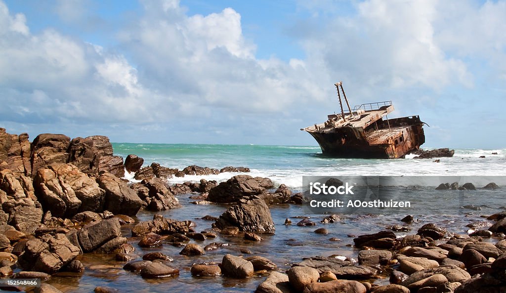 Aghullas shipwreck lying on the rocks Aghullas shipwreck lying on the rocks in the breakers Bay of Water Stock Photo