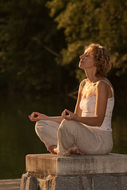 young lady meditation stock photo