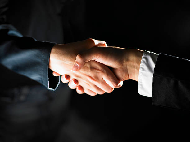 istock Photograph of illuminated handshake 152549233