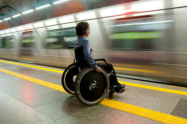 rollstuhl - train subway station people subway train stock-fotos und bilder