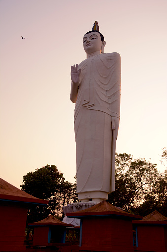 Big Buddha statue at sunset near Sigiriya, Sri Lanka