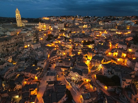 Drone shot of the ancient town of Matera - Sassi di Matera - in Basilicata, Italy, at night