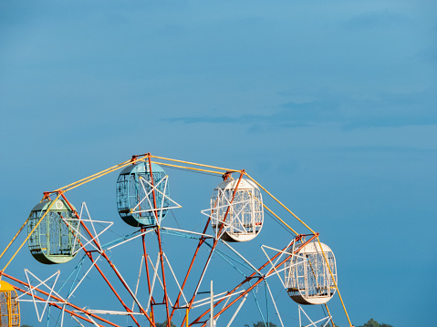 magnificent Ferris wheel, a towering marvel of engineering and amusement, beckoned thrill-seekers and dreamers alike. With its giant rotating wheel adorned with brightly colored gondolas, it offered.
