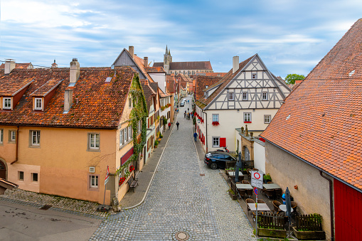 View of the rooftops of half timber homes and the skyline of St. James's Church from the medieval city's fortified walls' rampart walkway in Rothenburg ob der Tauber, Germany.