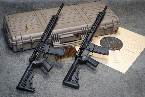 Two AR15 assault rifles and hard case for weapon, close-up photo